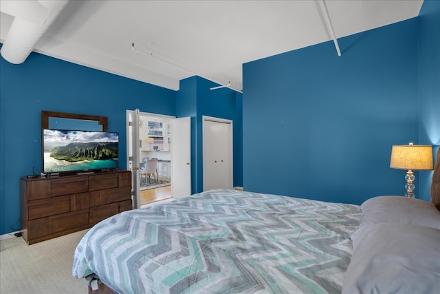 carpeted bedroom with a closet