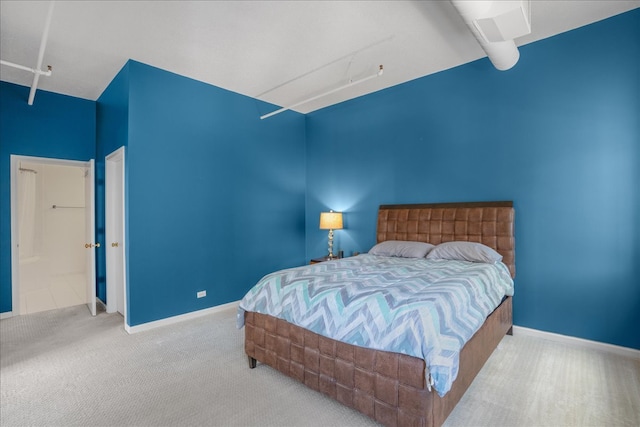 bedroom featuring light colored carpet