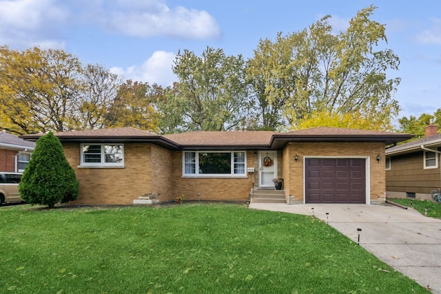 ranch-style home with a front yard and a garage