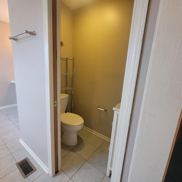 bathroom featuring tile patterned floors and toilet