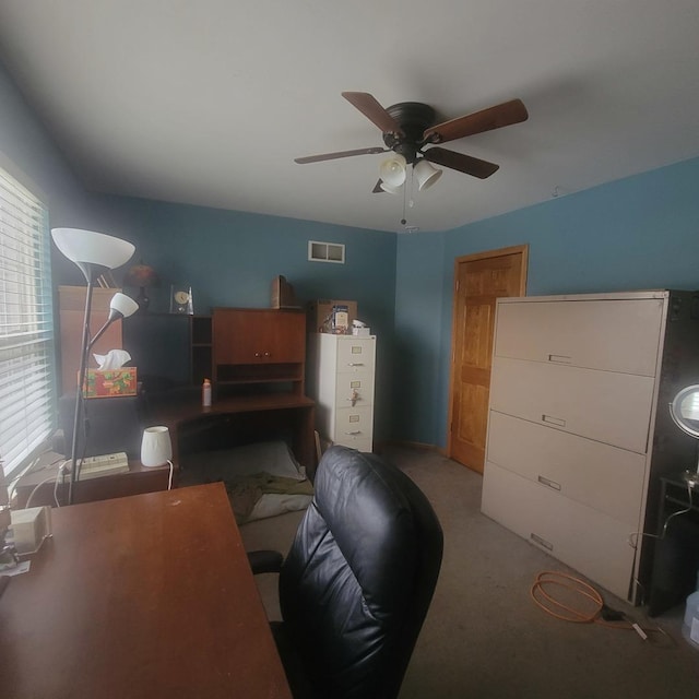 office area with ceiling fan, light colored carpet, and plenty of natural light