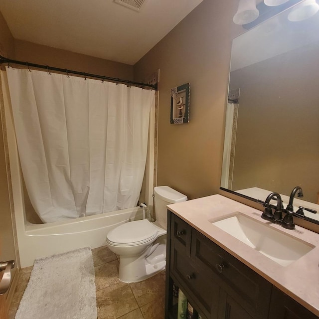 full bathroom with vanity, shower / bath combo, and toilet