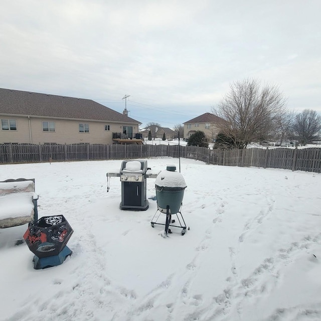 view of yard layered in snow