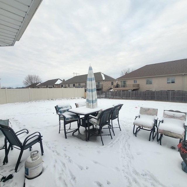 view of snow covered patio