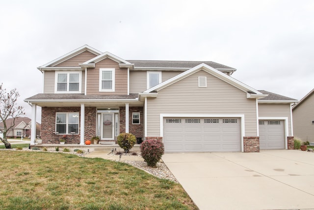 craftsman inspired home featuring a front yard and a garage