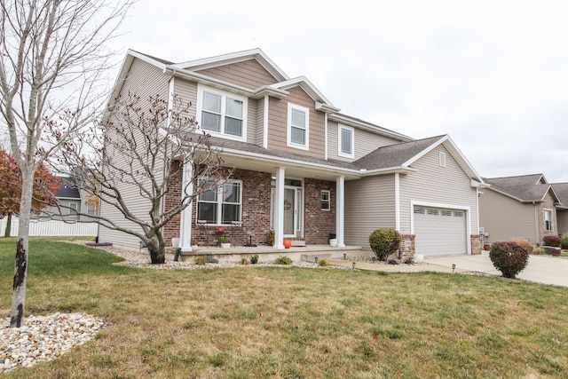 view of front of home with a front yard and a garage