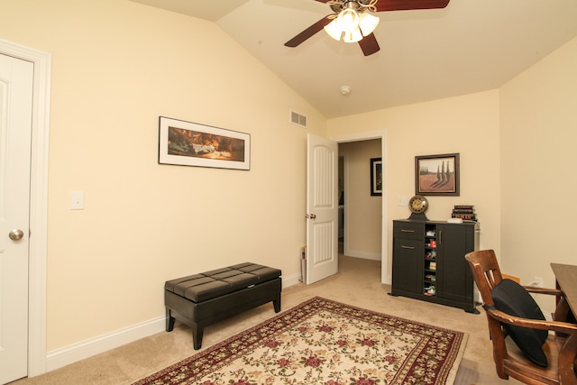 carpeted office featuring ceiling fan and lofted ceiling