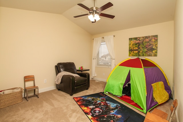 playroom featuring lofted ceiling, light carpet, and ceiling fan