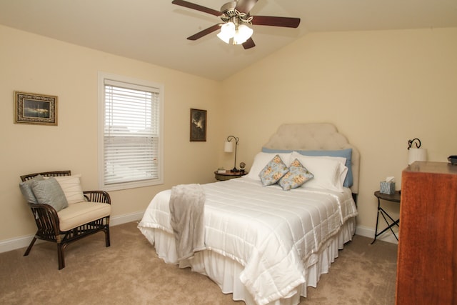 bedroom with lofted ceiling, light colored carpet, and ceiling fan