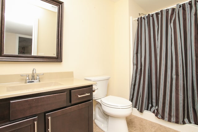 bathroom featuring vanity, toilet, and tile patterned floors