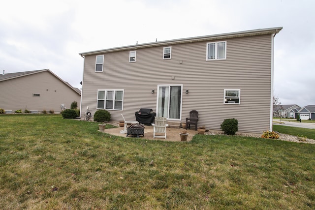 rear view of house featuring a patio area and a lawn