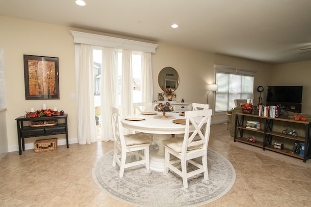 dining room featuring light tile patterned flooring and ceiling fan