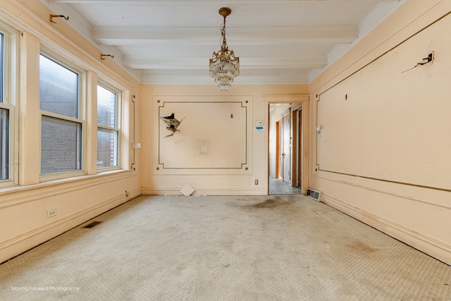 carpeted spare room featuring a notable chandelier and beamed ceiling