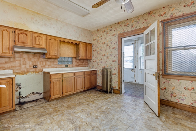 kitchen featuring ceiling fan and radiator heating unit