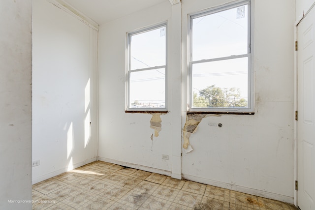 spare room with a wealth of natural light