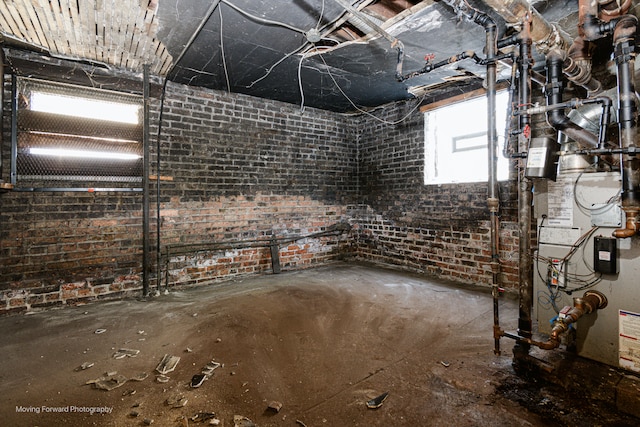 basement with brick wall