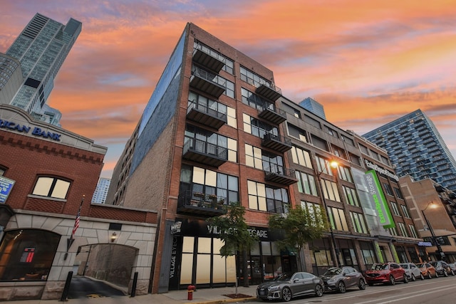 view of outdoor building at dusk