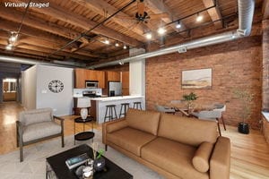 living room featuring wood ceiling, ceiling fan, light hardwood / wood-style flooring, beamed ceiling, and brick wall