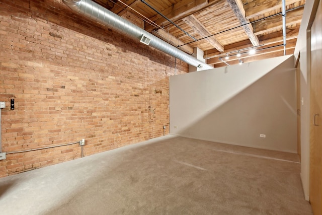 basement with brick wall