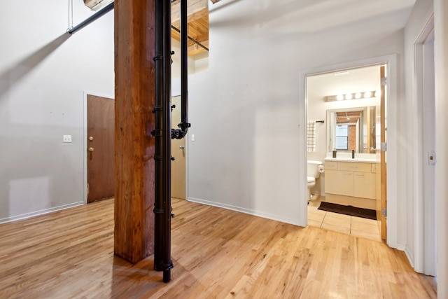 corridor featuring light hardwood / wood-style floors