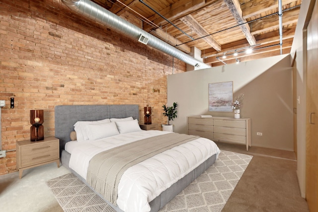 bedroom featuring brick wall