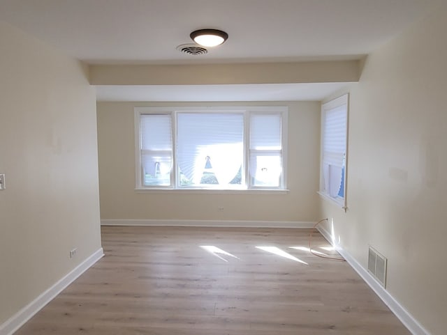 unfurnished room with light hardwood / wood-style flooring