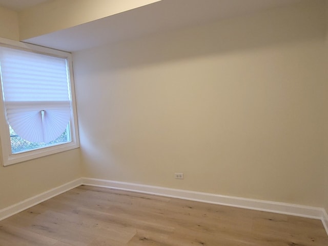 spare room featuring light hardwood / wood-style flooring