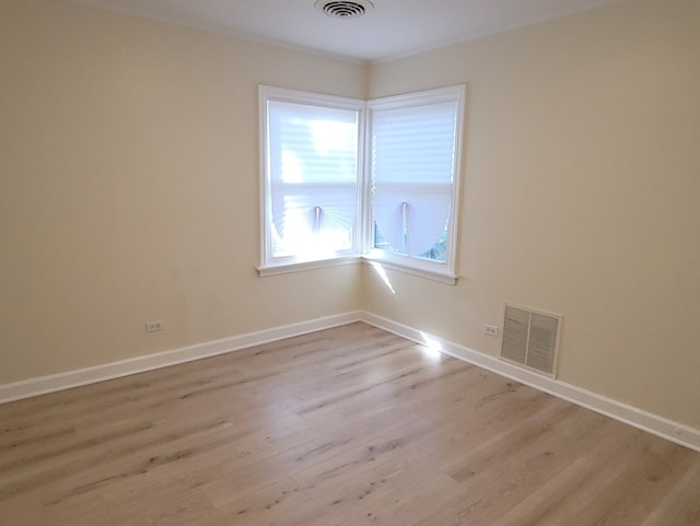 empty room with light wood-type flooring