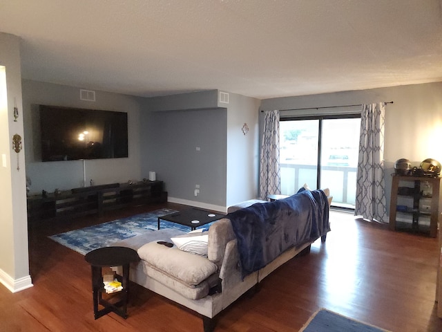 living room featuring dark hardwood / wood-style flooring