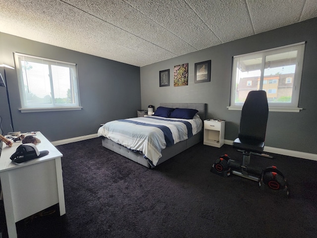 bedroom featuring dark carpet