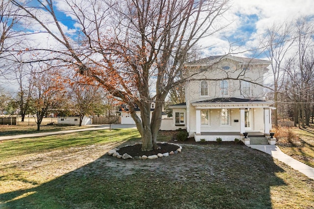 view of front of home featuring a front lawn and a garage