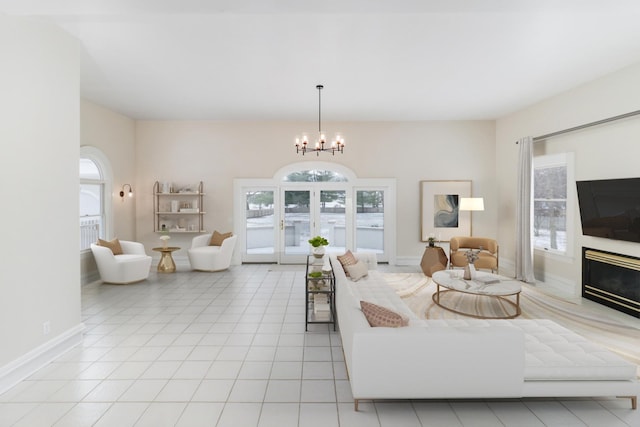 tiled living room with an inviting chandelier