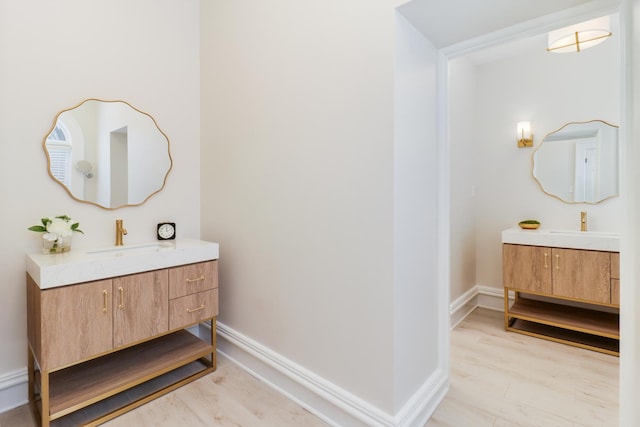 bathroom with wood-type flooring and vanity