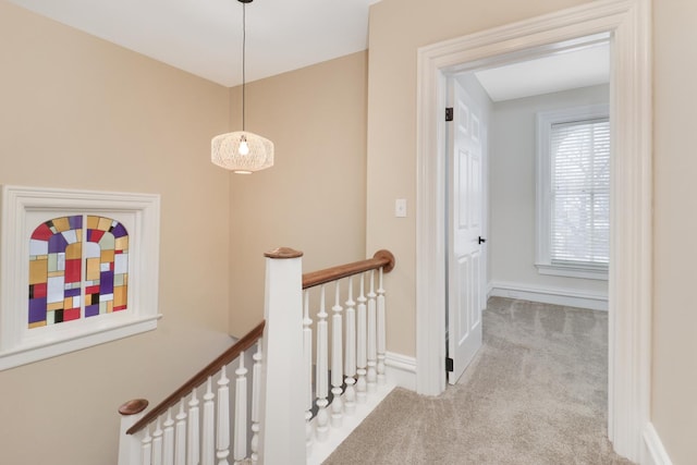 hallway with light carpet