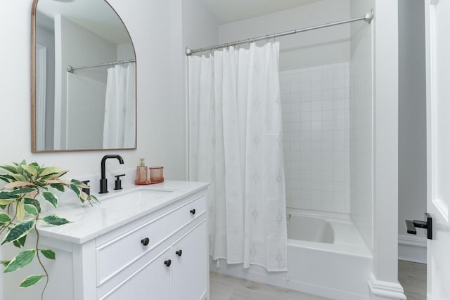 bathroom with vanity and shower / bath combo with shower curtain