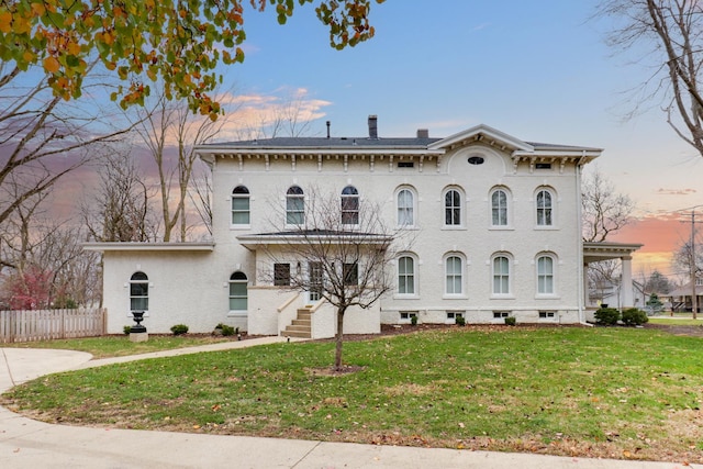 italianate-style house with a lawn