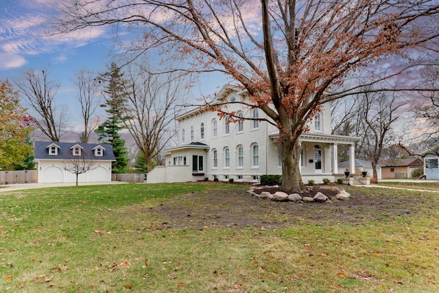 view of front facade featuring a lawn and covered porch