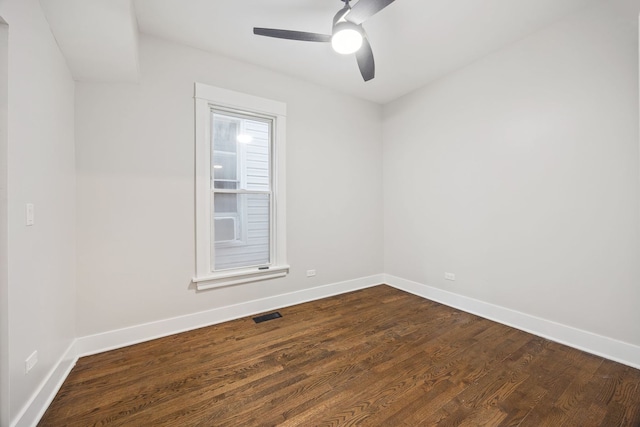 empty room with ceiling fan and hardwood / wood-style flooring