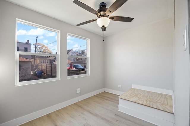 interior space with ceiling fan and light wood-type flooring