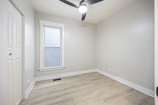 empty room featuring ceiling fan and light hardwood / wood-style flooring