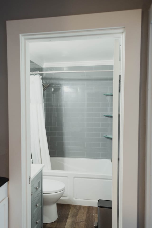 full bathroom with toilet, vanity, shower / bath combination with curtain, and hardwood / wood-style flooring