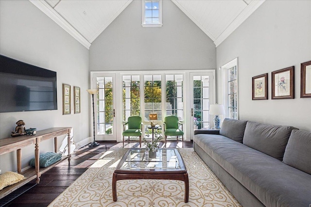 living room with hardwood / wood-style flooring, crown molding, and high vaulted ceiling