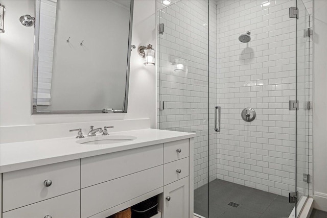 bathroom with vanity and a shower with shower door