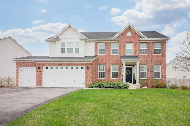 view of front of home featuring a garage and a front lawn