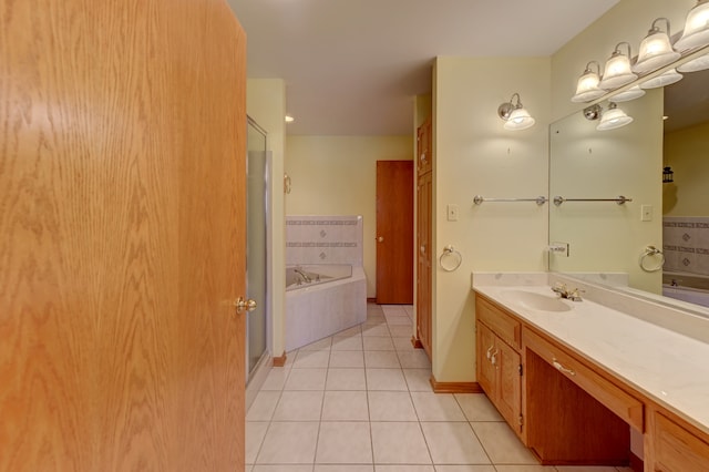 bathroom featuring vanity, independent shower and bath, and tile patterned floors