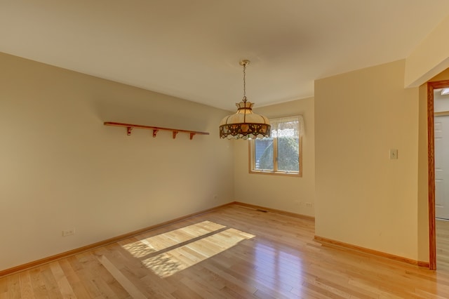 unfurnished dining area featuring light hardwood / wood-style flooring