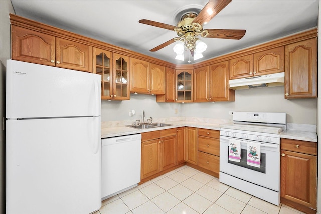 kitchen featuring sink, white appliances, light tile patterned floors, and ceiling fan