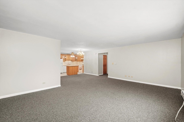 interior space with a chandelier and dark colored carpet