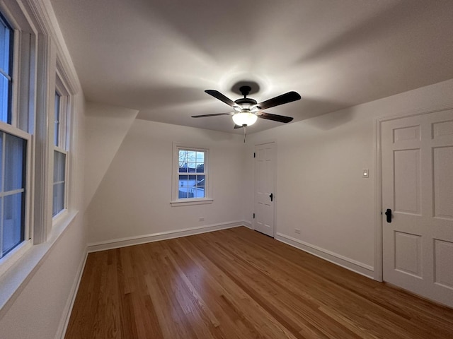 spare room with ceiling fan and hardwood / wood-style floors