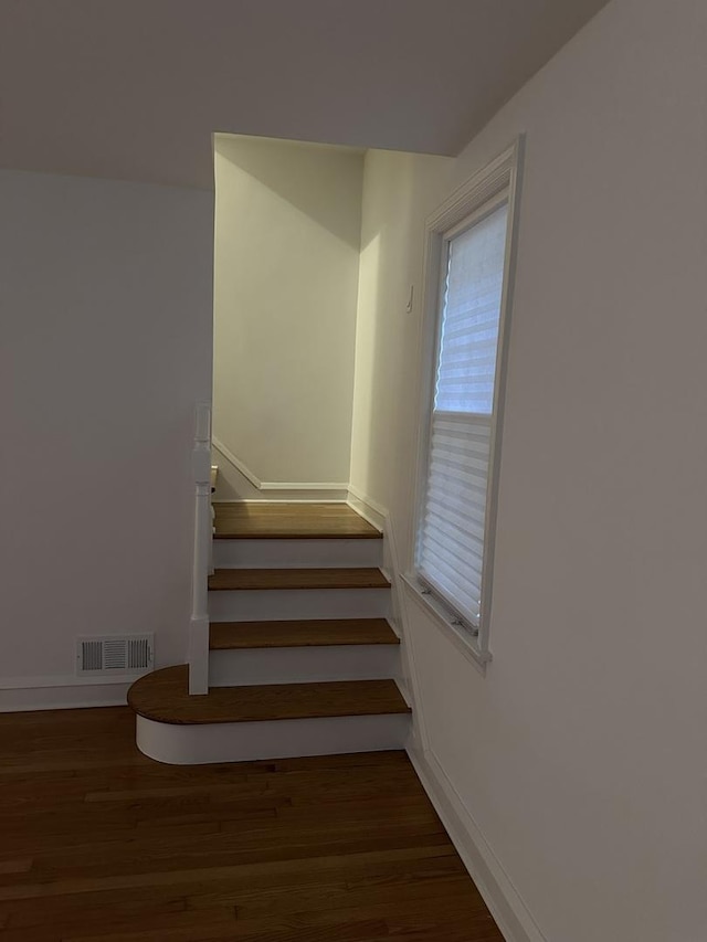 8646 S Nagle Ave, Burbank, IL 60459 - staircase with baseboards, visible vents, and wood finished floors